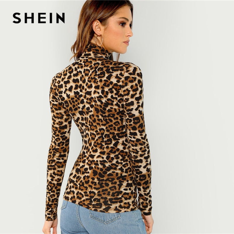 SHEIN Leopard Tee top Brand Name: SheIn Material: Polyester, SpandexItem Type: Tops Fabric Type: Broadcloth Style: BohemianPattern Type: Leopard Sleeve Length(cm): FullGender: Women Collar: StandFabric: Fabric has some stretch Material: 95% Polyester, 5% Spandex Style: Casual, High-street, Office Lady Decoration: Sheer, Contrast Mesh, Asymmetrical Pattern Type: Leopard Neckline: High Neck Size Details (cm)     Shoulder (cm) Bust (cm) Cuff (cm) Sleeve Length  (cm) Length(cm) XS 33 67 17 38